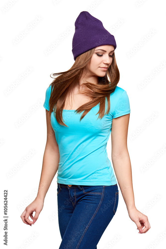 Smiling teen girl standing in hat Smiling teen girl standing in hat