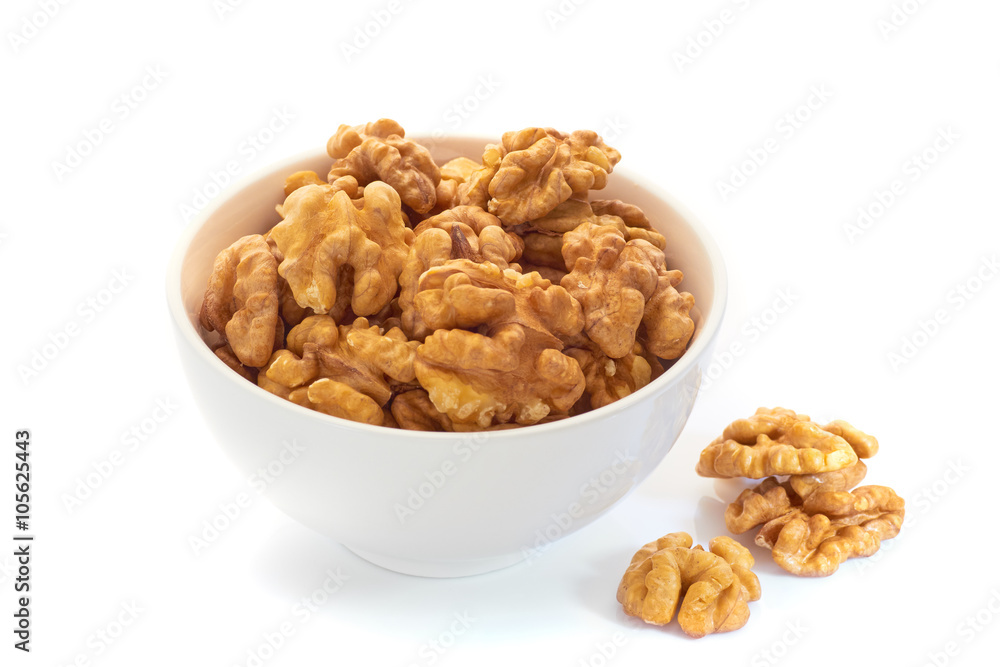 Walnuts in white bowl isolated on white background Walnuts in white bowl isolated on white background