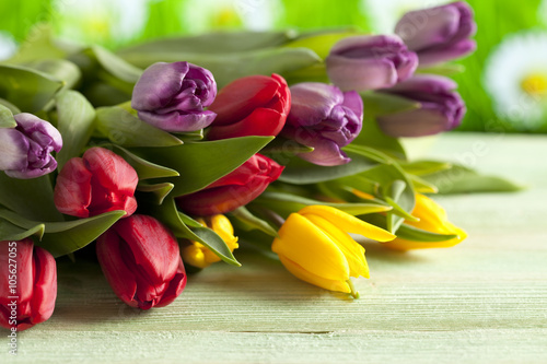 Fototapeta Naklejka Na Ścianę i Meble -  Colorful tulips on wooden table