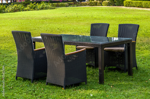 Rattan furniture, table and chairs, cushion  outdoors © praethip