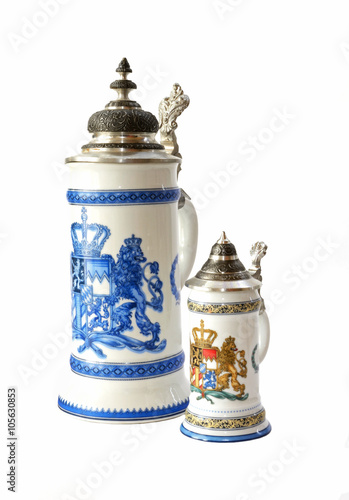Two vintage beer mugs with bavarian Coat of Arms Lion isolated over a white background