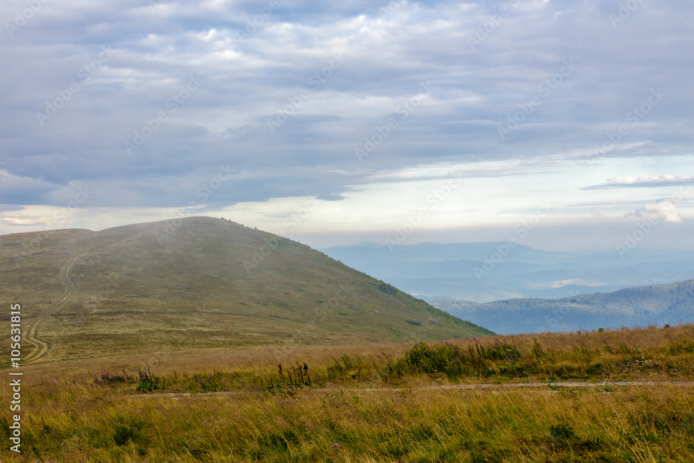 morning fog covers the mountains top