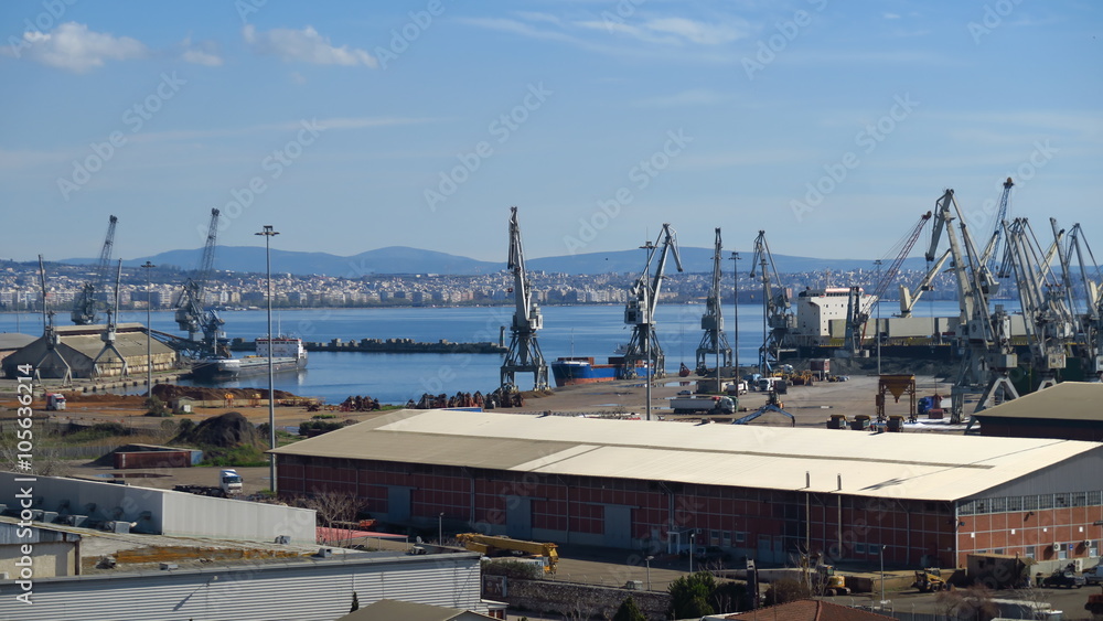Port cranes handling containers at Thessaloniki port, Greece.