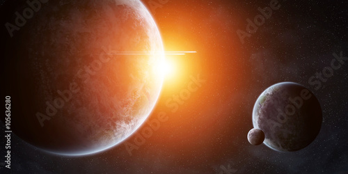 Fototapeta Naklejka Na Ścianę i Meble -  Sunrise over planets in space