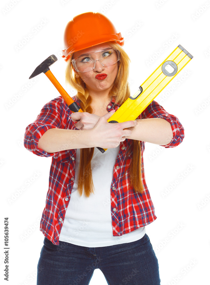 Funny woman in helmet with the work tools on a white Funny woman in helmet with the work tools on a white