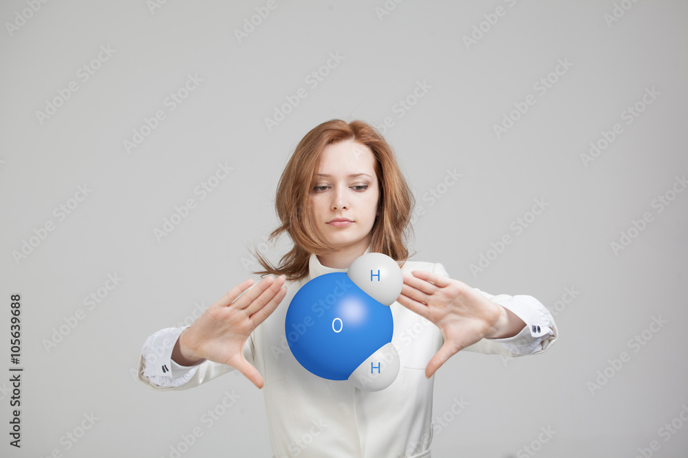 Young woman scientist with model of water molecule. Young woman scientist with model of water molecule.