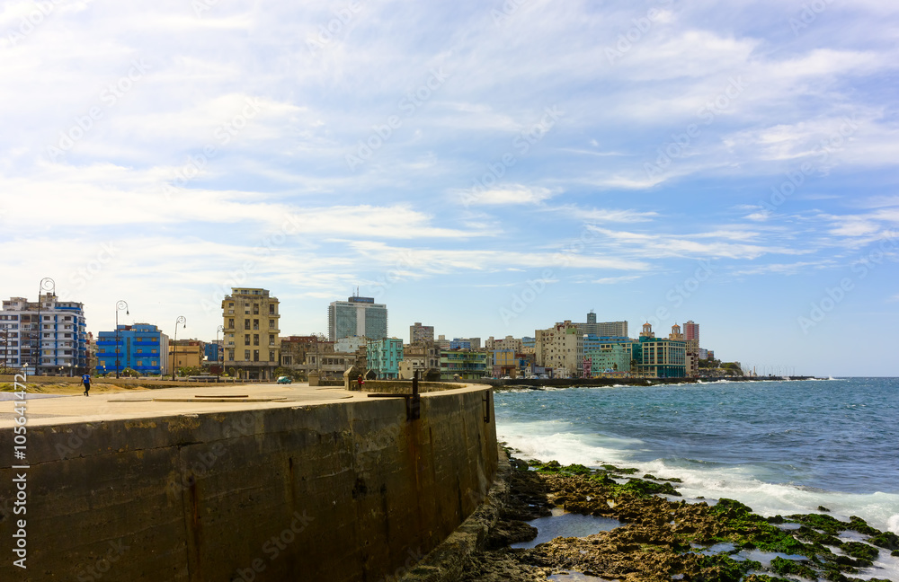 Sea wall and buildings on Malecon Boulevard in Havana, Cuba