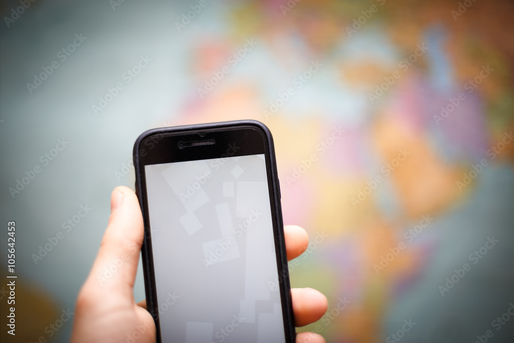 smart phone navigation at wall map background