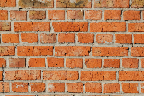 old red brick wall close up.