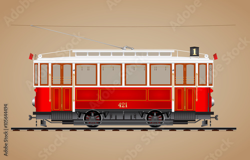 Traditional red tram on tre rail side view