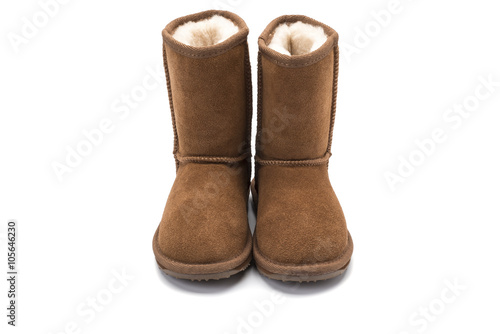 brown fluffy ugg boot style childrens footwear on white backgrou
