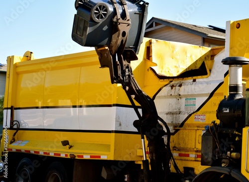 Garbage Day2 / Mechanical lifting arm grabbing the trash bin to dispose of its contents.