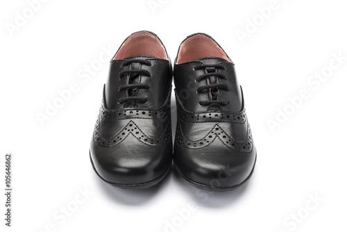 girls black school shoe on a white background