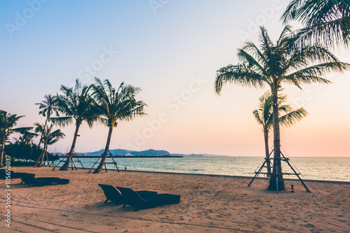 Palm tree on the beach © siraphol