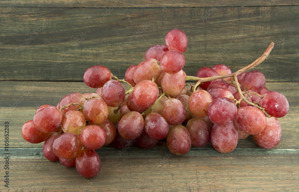 Delicious grapes on wooden background Delicious grapes on wooden background