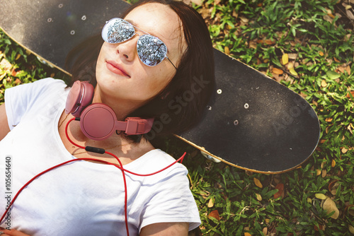 Slika na platnu Skateboard Relaxation Rest Lying Chill Headphone Concept