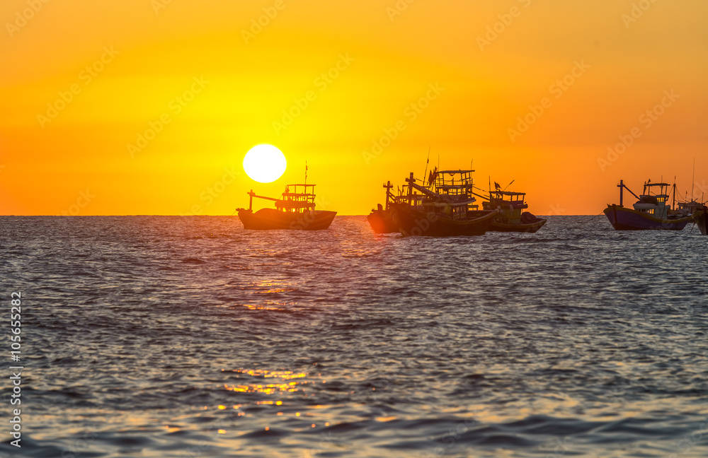 Sunset over the sea as the sun pier horizon rounded bottom makes sunset boat with yellow sky it's great to watch
