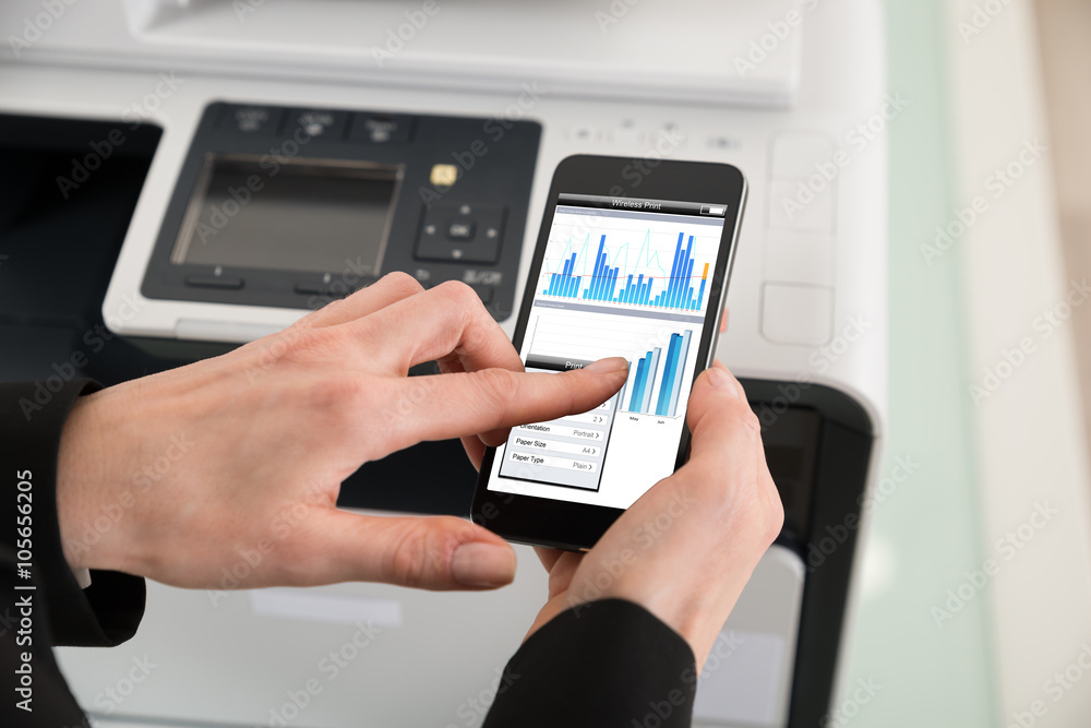 Businesswoman Giving Print Command On Smart Phone Businesswoman Giving Print Command On Smart Phone