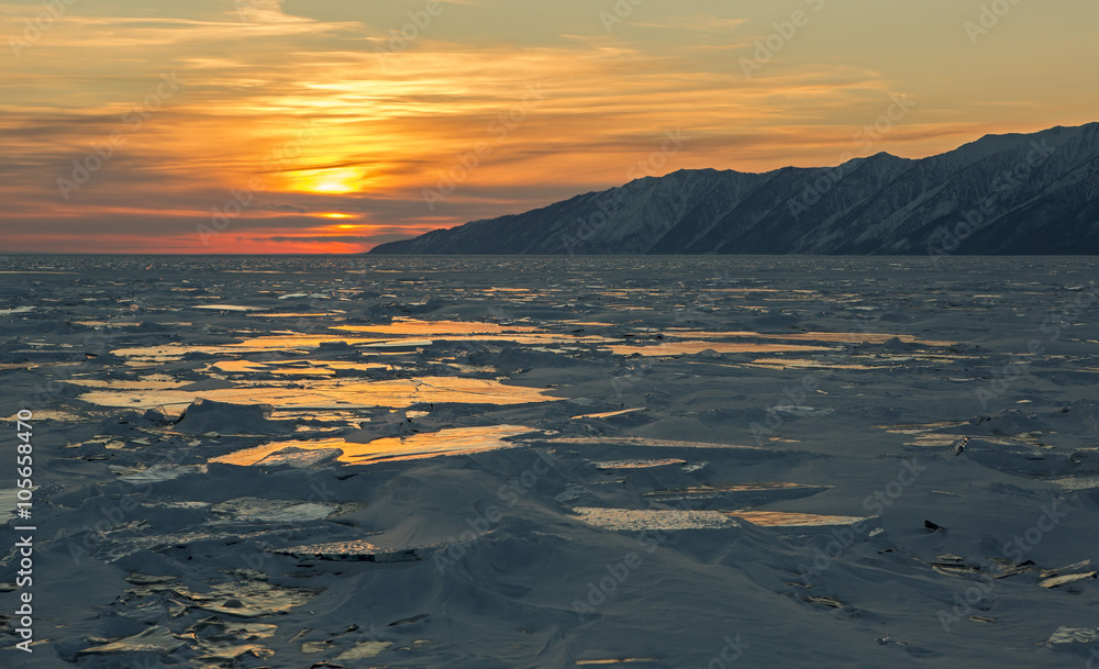 Sunset reflected in the ice floes.