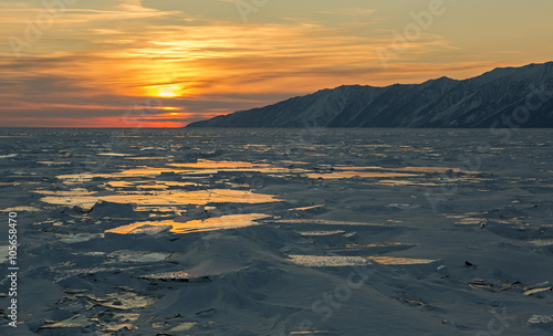 Sunset reflected in the ice floes.