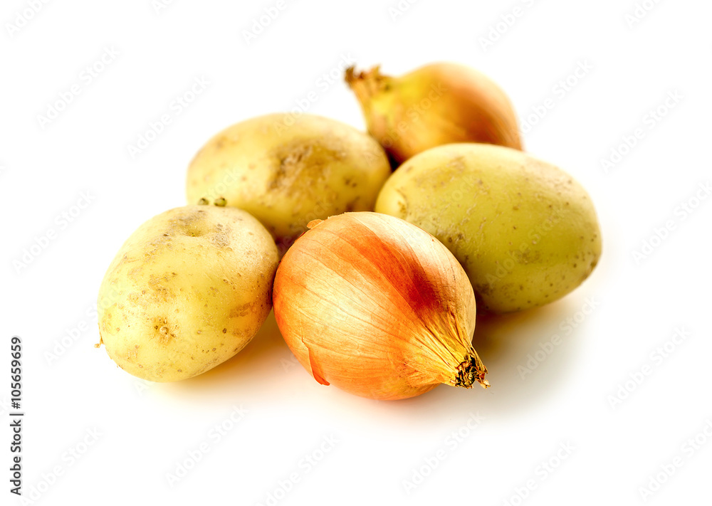 Nutritious unpeeled onions and potatoes isolated on white Nutritious unpeeled onions and potatoes isolated on white