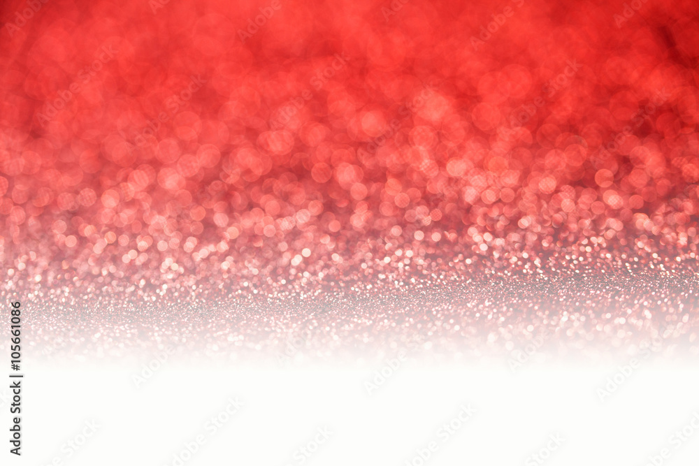 Red glitter surface with red light bokeh with white copyspace