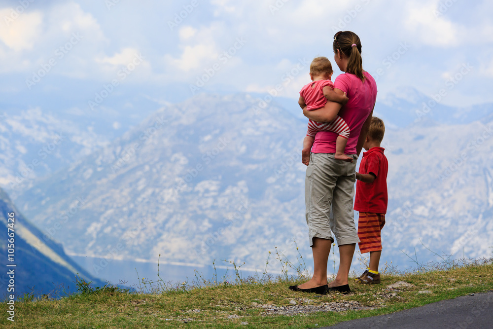 mother with kids travel in mountains