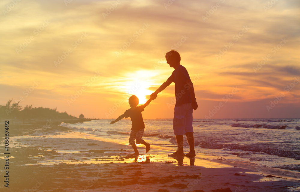 Fototapeta premium father and son having fun at sunset