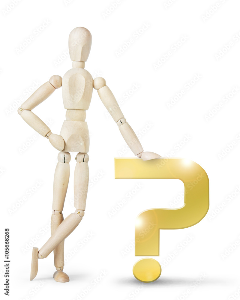 Man leaned against a large golden question mark. Abstract image with a wooden puppet
