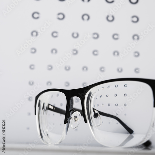 black eye glasses and focus exam test.