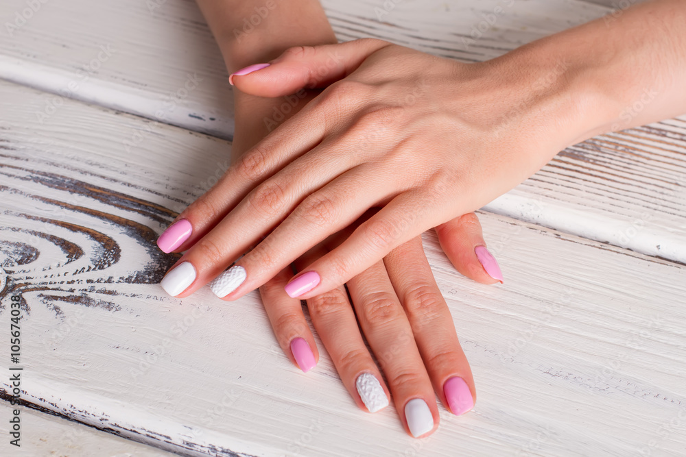 Fototapeta premium Delicate white and pink manicure.