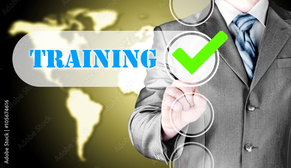 Businessman pressing touch screen interface training checkbox Businessman pressing touch screen interface training checkbox
