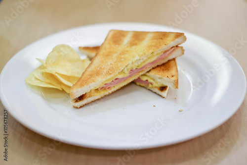 A grilled ham and swiss cheese sandwich