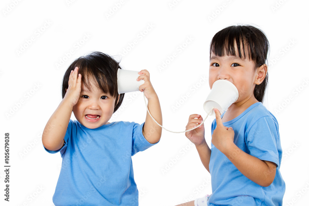 Asian Little Chinese Girls Playing with Paper Cups Asian Little Chinese Girls Playing with Paper Cups