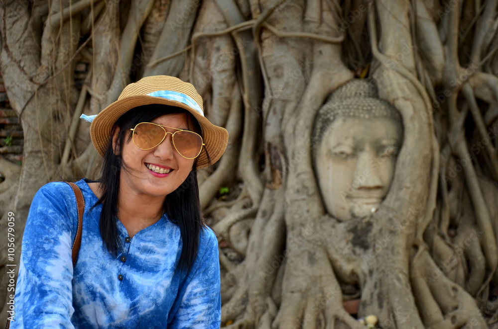 Stone head of buddha in root tree of Wat Mahathat