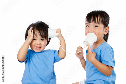 Asian Little Chinese Girls Playing with Paper Cups