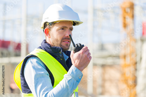 Portrait of an attractive worker on a construction site photo