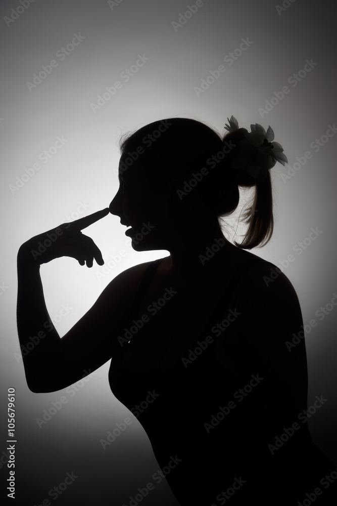 Silhouette of beautiful young woman