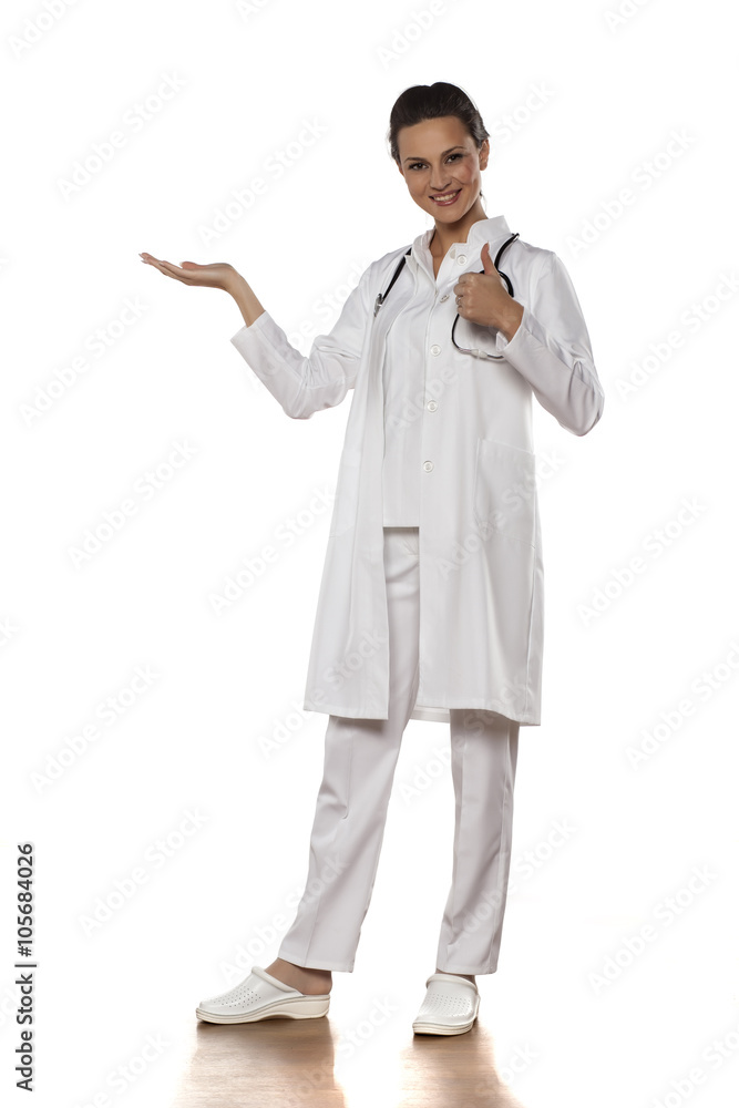 a young woman doctor in uniform holding imaginary object a young woman doctor in uniform holding imaginary object