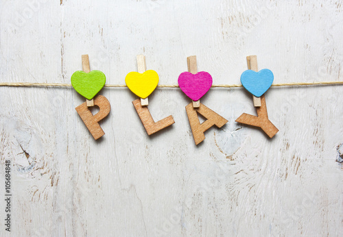 word play with wooden letters on a white background