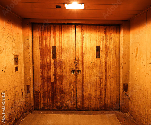Old and rusty closed elevator doors