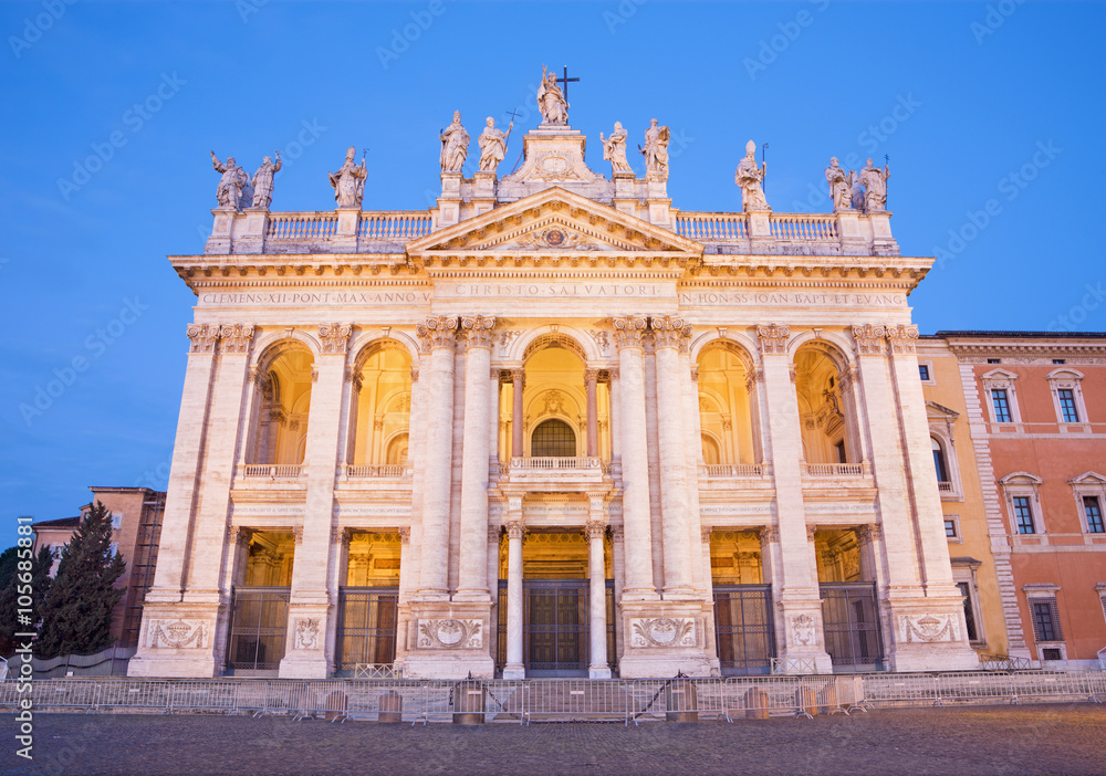 Rome - The facade of St. John Lateran basilica (Basilica di San Giovanni in Laterano) at dusk
