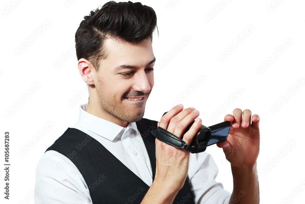 man holding an HD camcorde man holding an HD camcorde