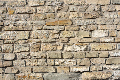 Wall of big rough granite boulders