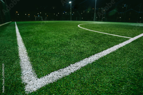 Close up of soccer or football field at night 