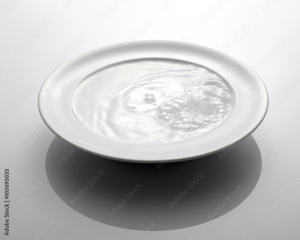 white plate with water white plate with water