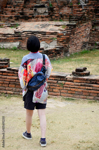 People travel and walking around ancient building at Wat Mahatha photo