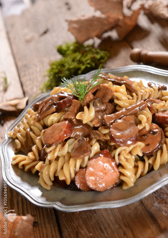 Fussili pasta with mushrooms and sausage Fussili pasta with mushrooms and sausage