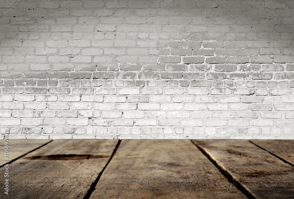 Fototapeta premium Wood table with White brick wall background