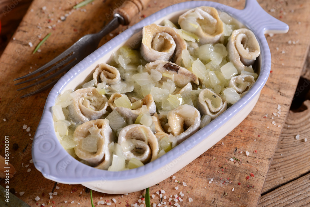 Marinated herring rools with oil and onion Marinated herring rools with oil and onion